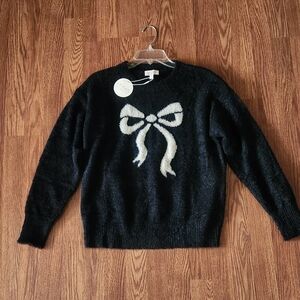 Elegant Black Sweater with White Bow by Stitch